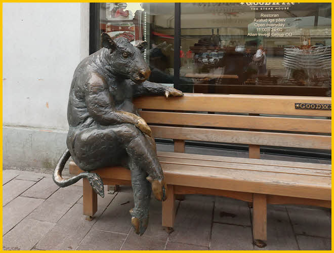 Steer Sitting Outside<BR> Steak House